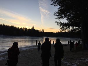 Sunset over frozen lake