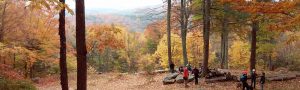 Scenic view of hills in Autumn with hikers