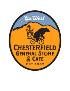 An oval orange and blue logo of a bear riding a bike over a mountain with the text "Go West, Chesterfield General Store and Cafe, est. 1967."